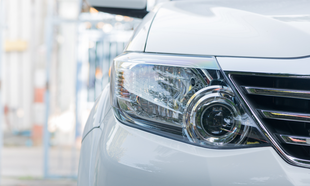 Right headlight of white vehicle