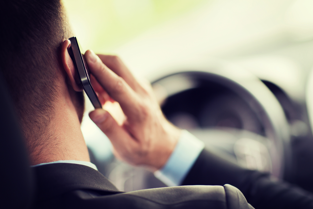 Man in car on phone Man in car on phone
